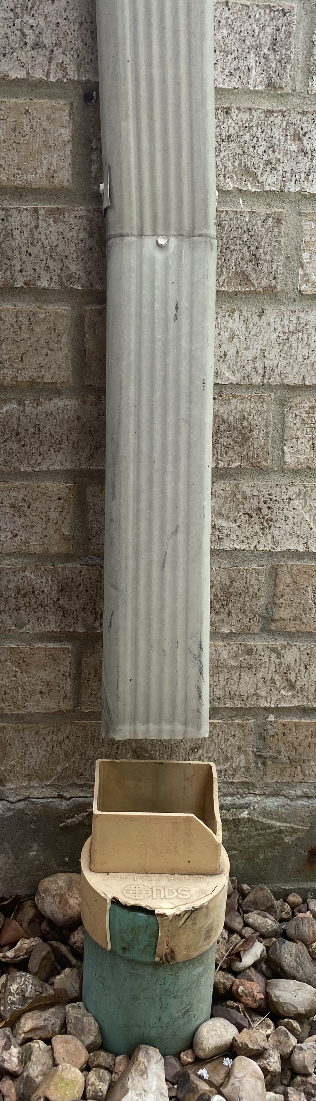 Downpipe routing and discharge point.
